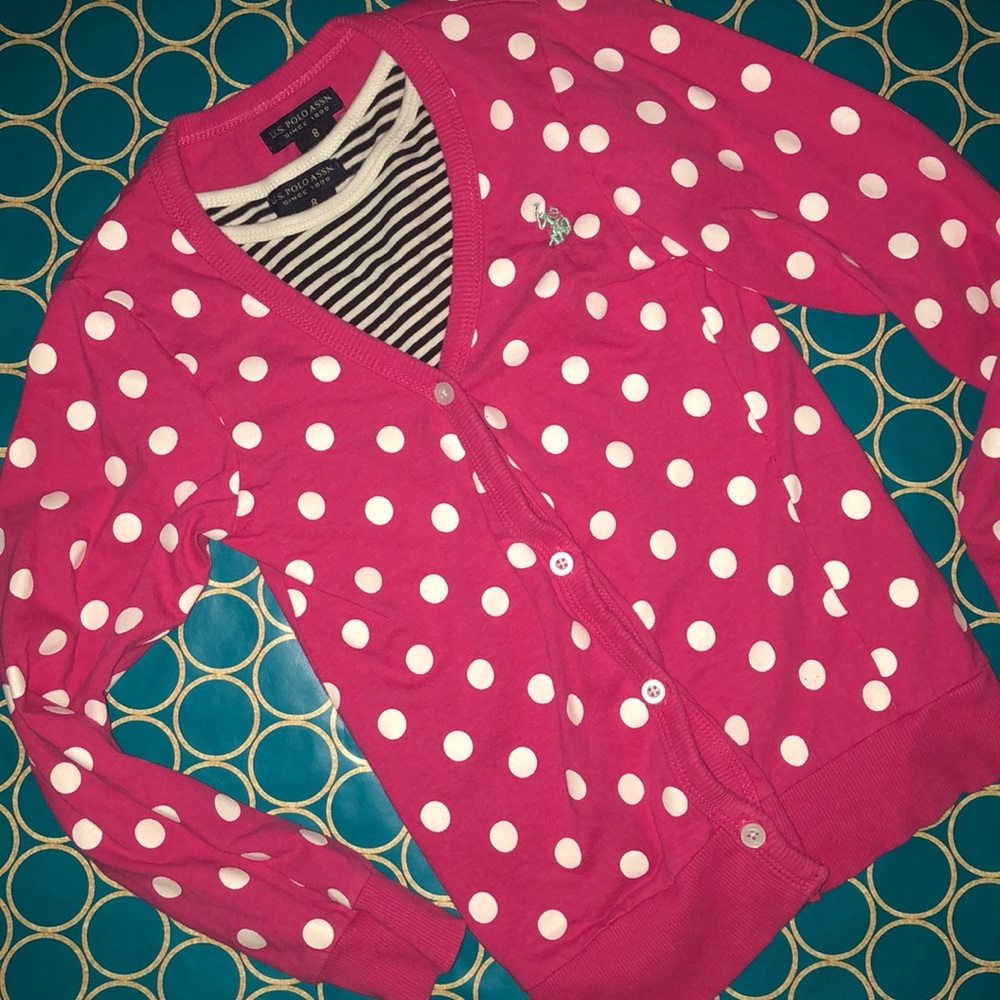 Pink polka dot cardigan with black and white shirt
